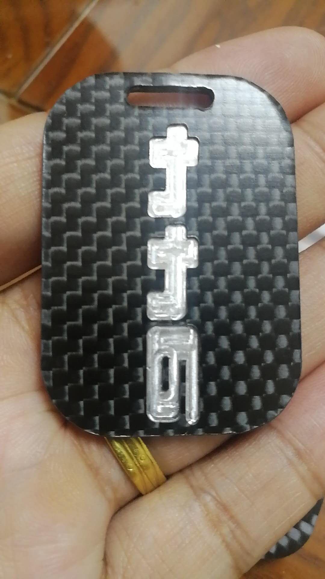 Carbon fiber double-sided hollow logo detail