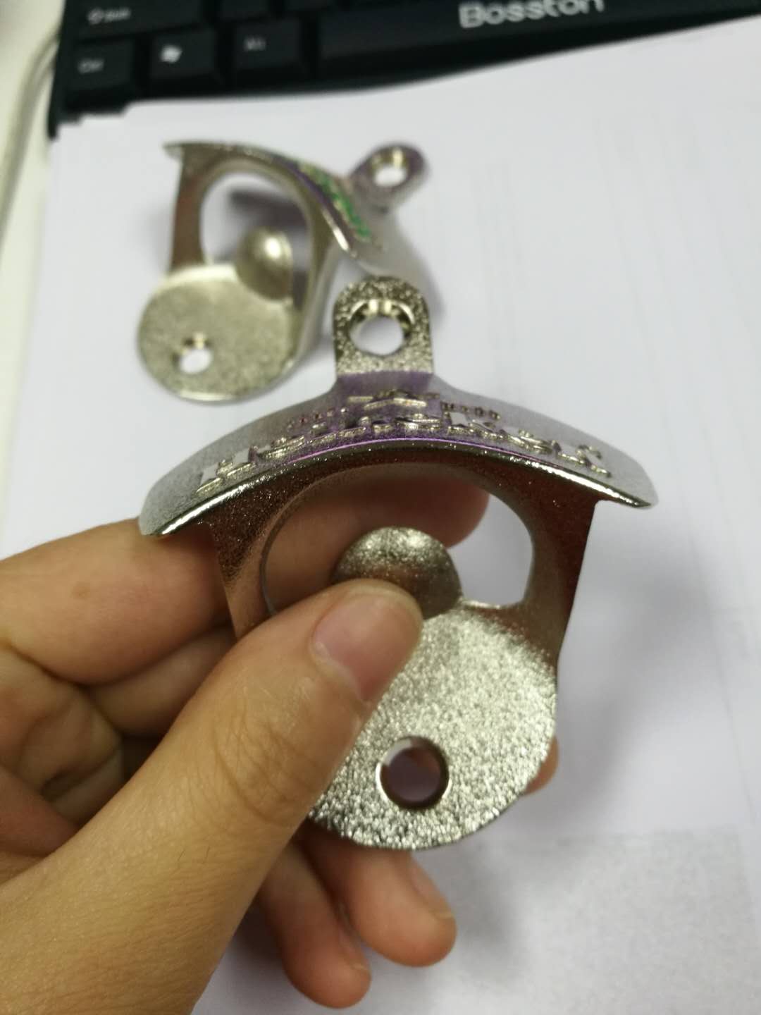 Heineken bottle opener, color and no-color logo versions together